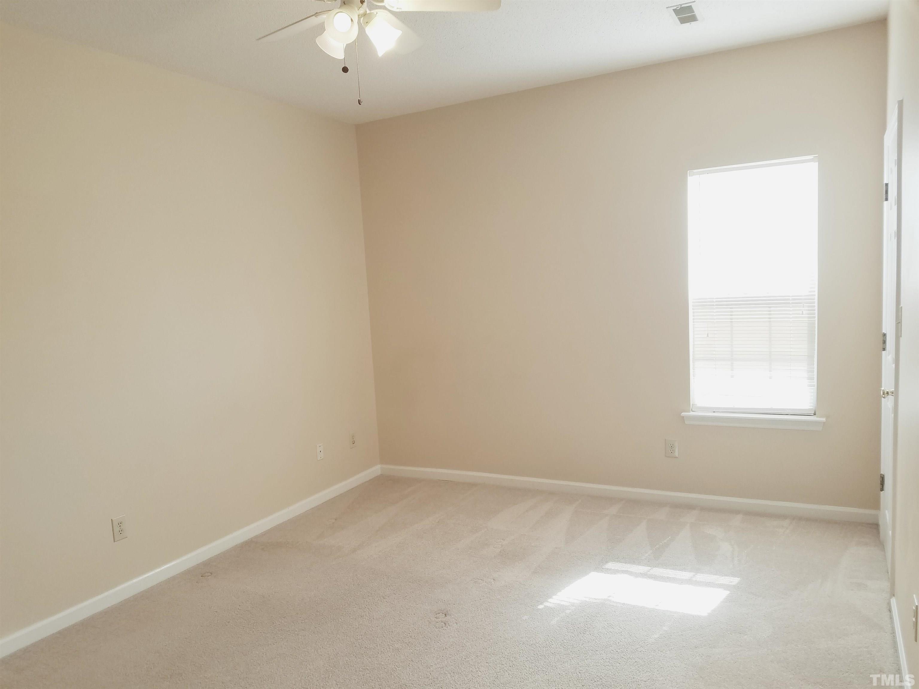 1815 Collier Road Durham, NC 27707 - Photo 9 of 14 an empty room with a window