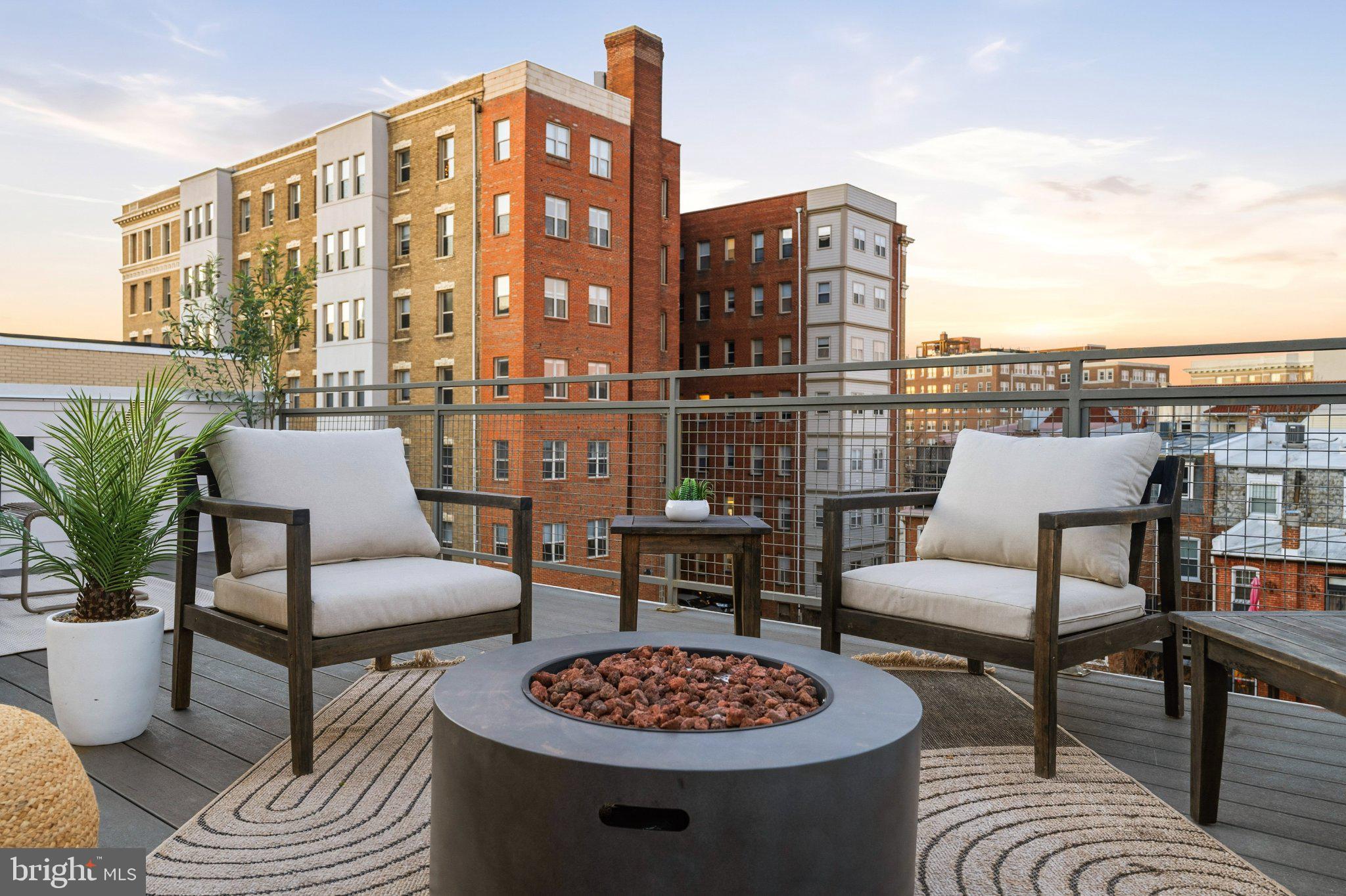 1837 Kalorama Road Northwest, Unit F Washington, DC 20009 - Photo 34 of 42 Urban rooftop retreat at sunset.