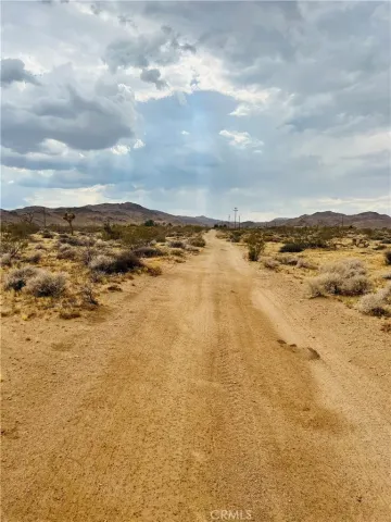 a view of a street with cars