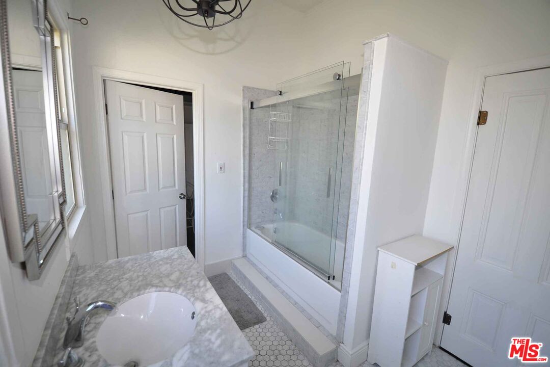 2315 2nd Street, Unit A Santa Monica, CA 90405 - Photo 14 of 17 a bathroom with a shower and a sink