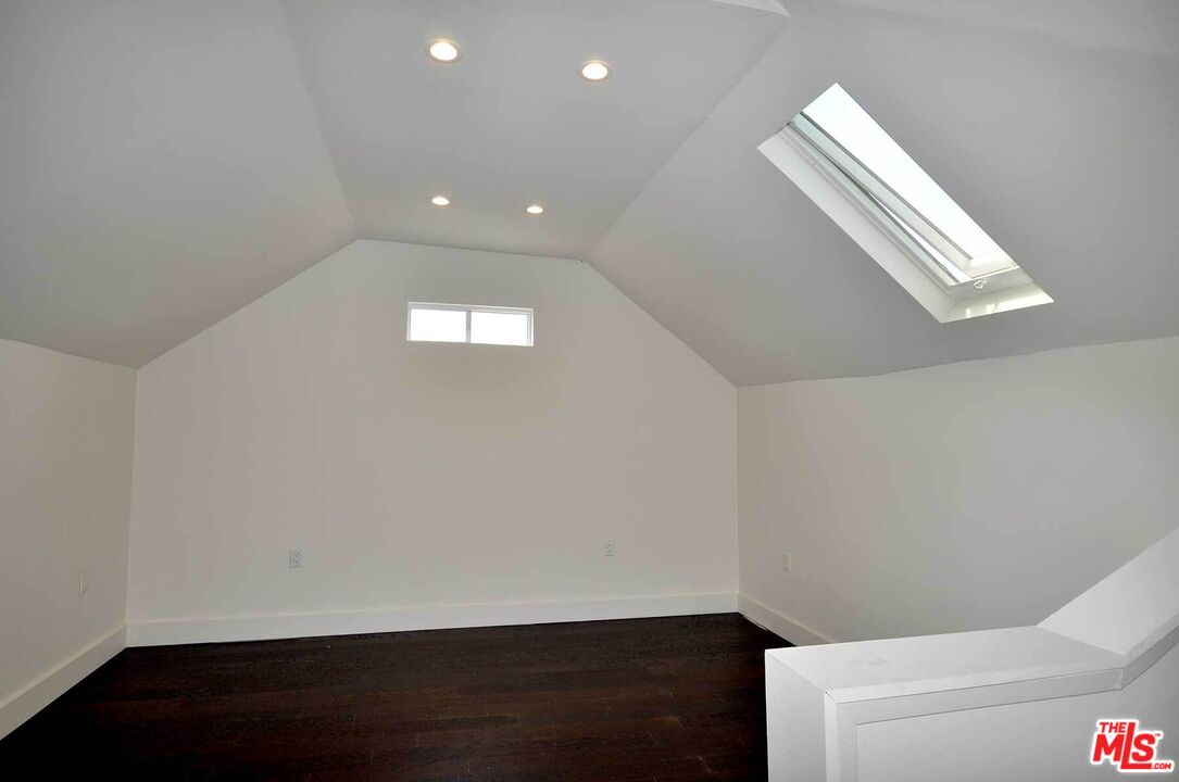 2315 2nd Street, Unit A Santa Monica, CA 90405 - Photo 15 of 17 a view of hallway with stairs and wooden floor