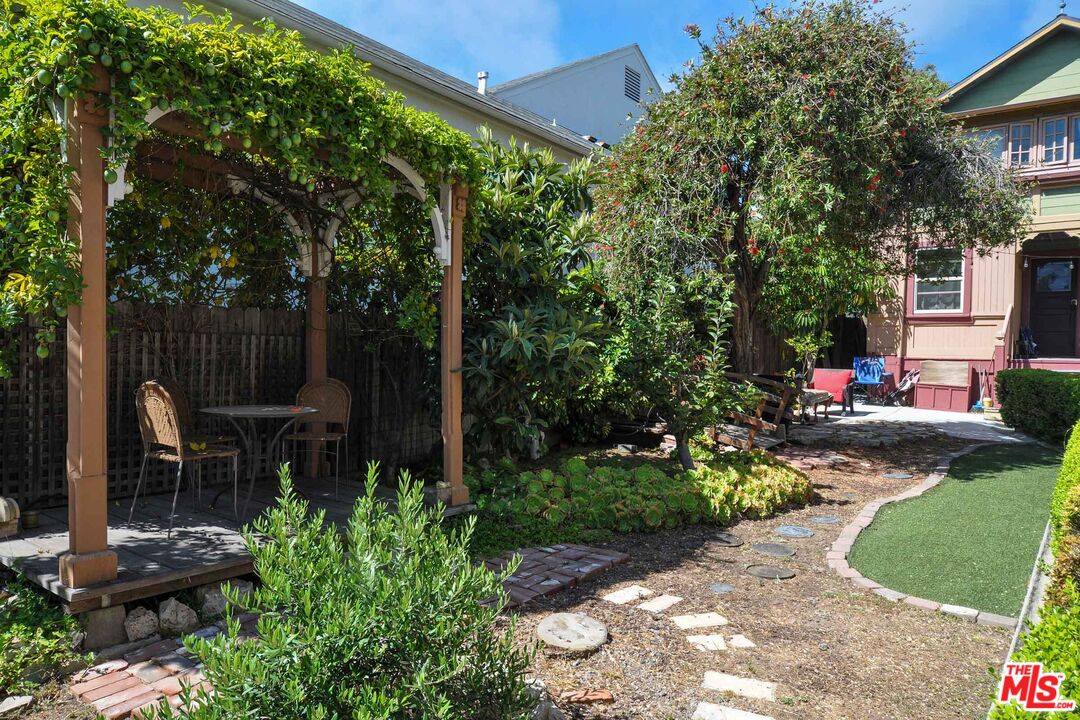 2315 2nd Street, Unit A Santa Monica, CA 90405 - Photo 2 of 17 a view of a chair and table in backyard