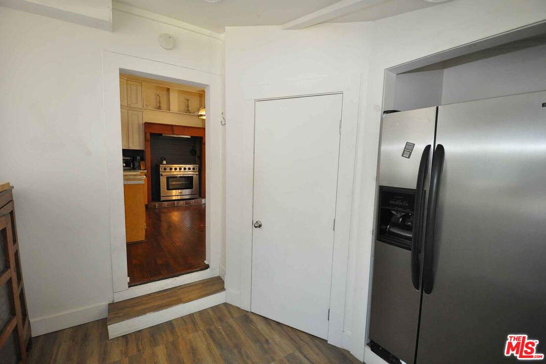 2315 2nd Street, Unit A Santa Monica, CA 90405 - Photo 7 of 17 a view of a hallway with wooden floor and closet