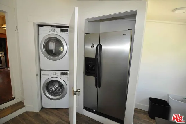 a view of a hallway with washer and dryer