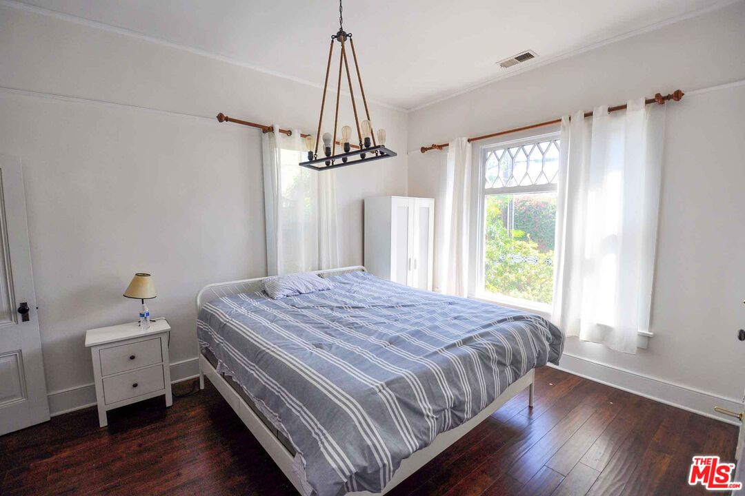 2315 2nd Street, Unit A Santa Monica, CA 90405 - Photo 9 of 17 a bedroom with a bed and a window