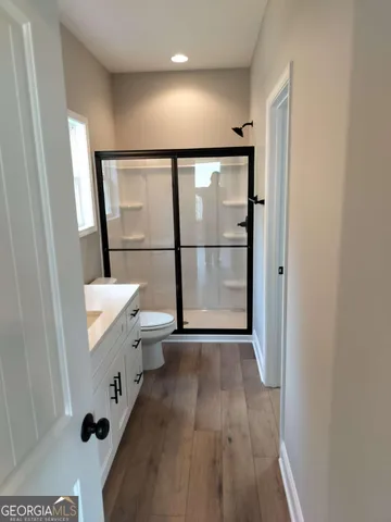 a view of entryway with wooden floor