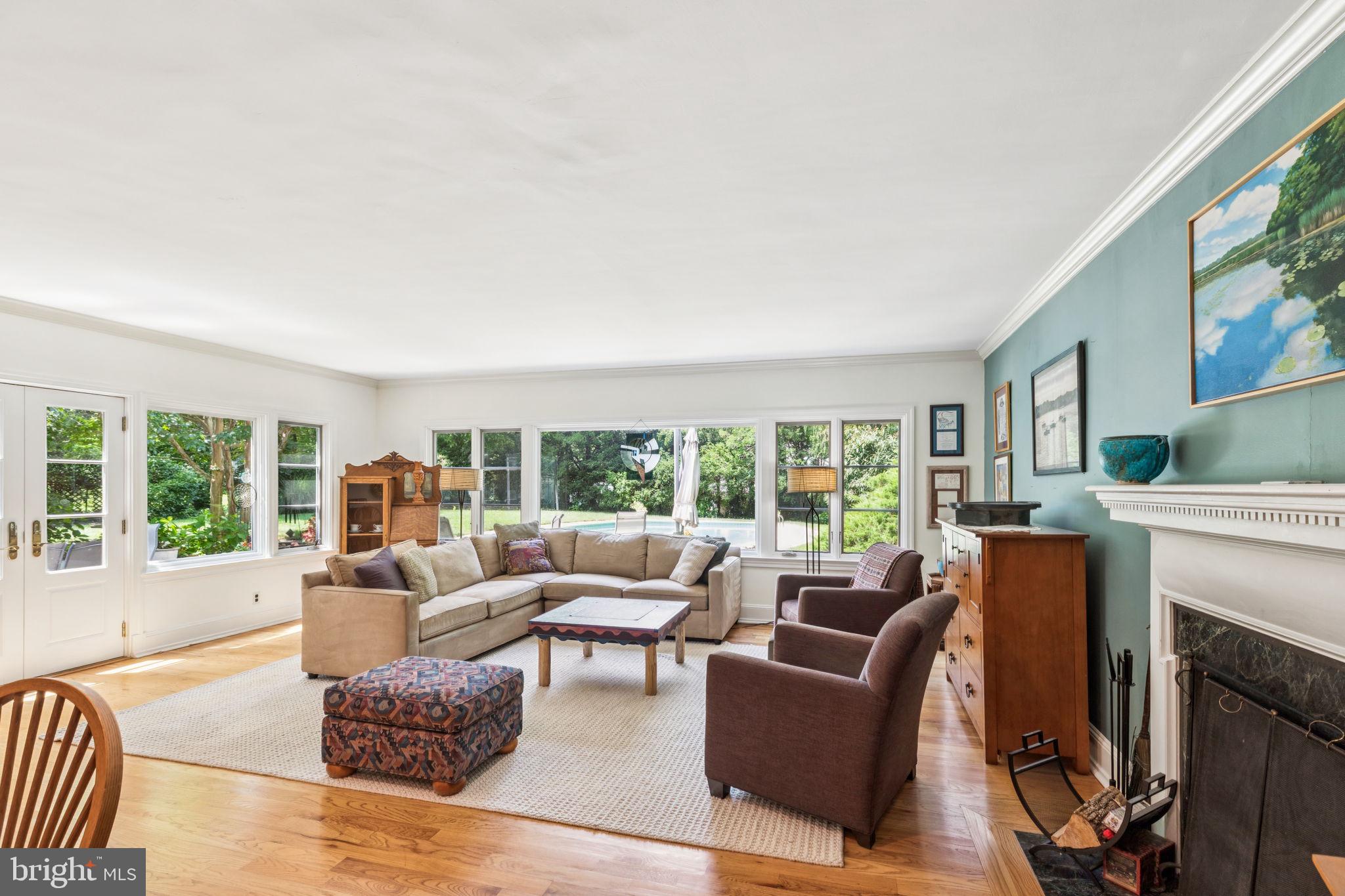 744 Clarendon Road Penn Valley, PA 19072 - Photo 13 of 41 a living room with furniture and a fireplace