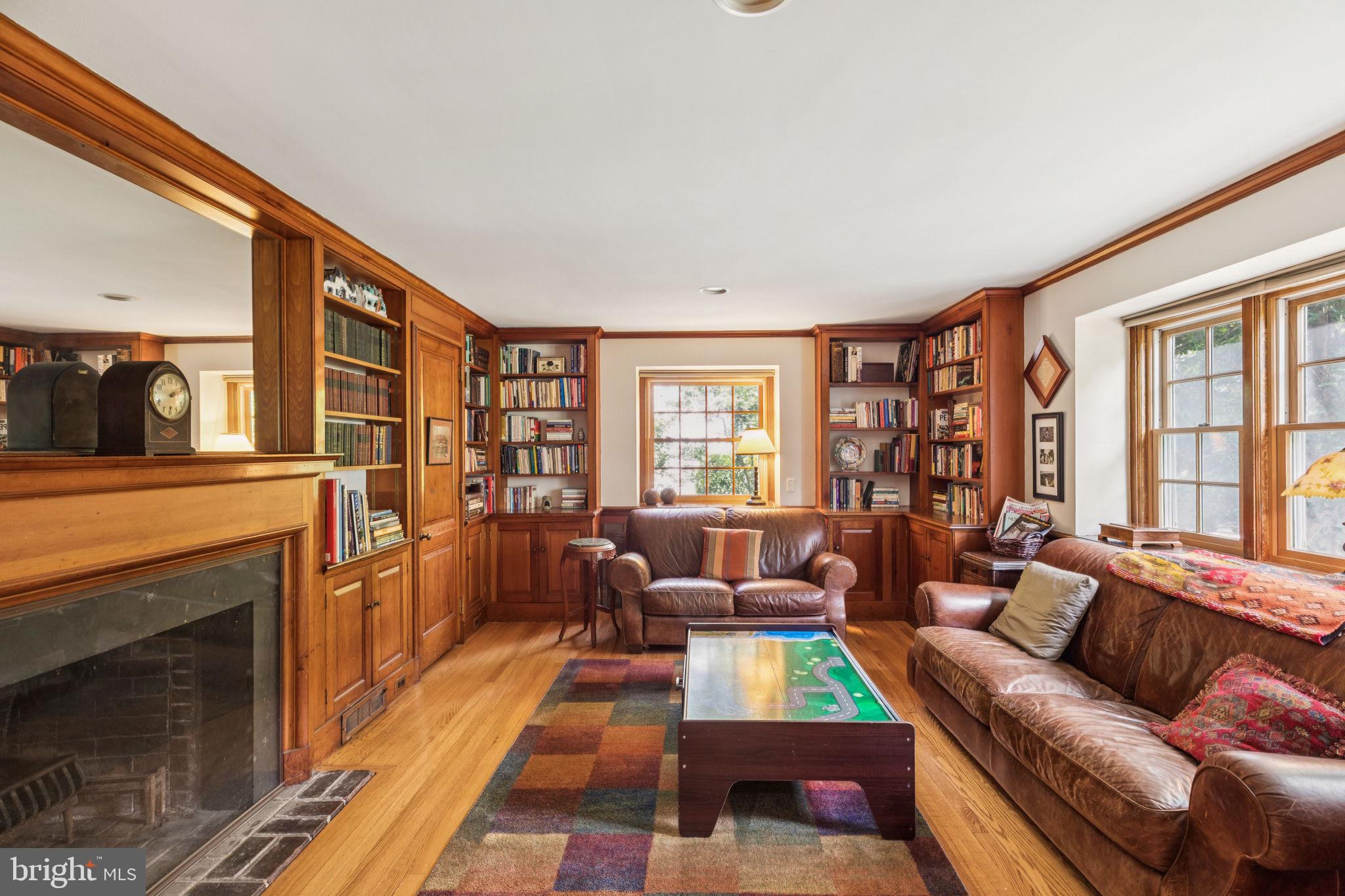 744 Clarendon Road Penn Valley, PA 19072 - Photo 16 of 41 a living room with furniture and a fireplace