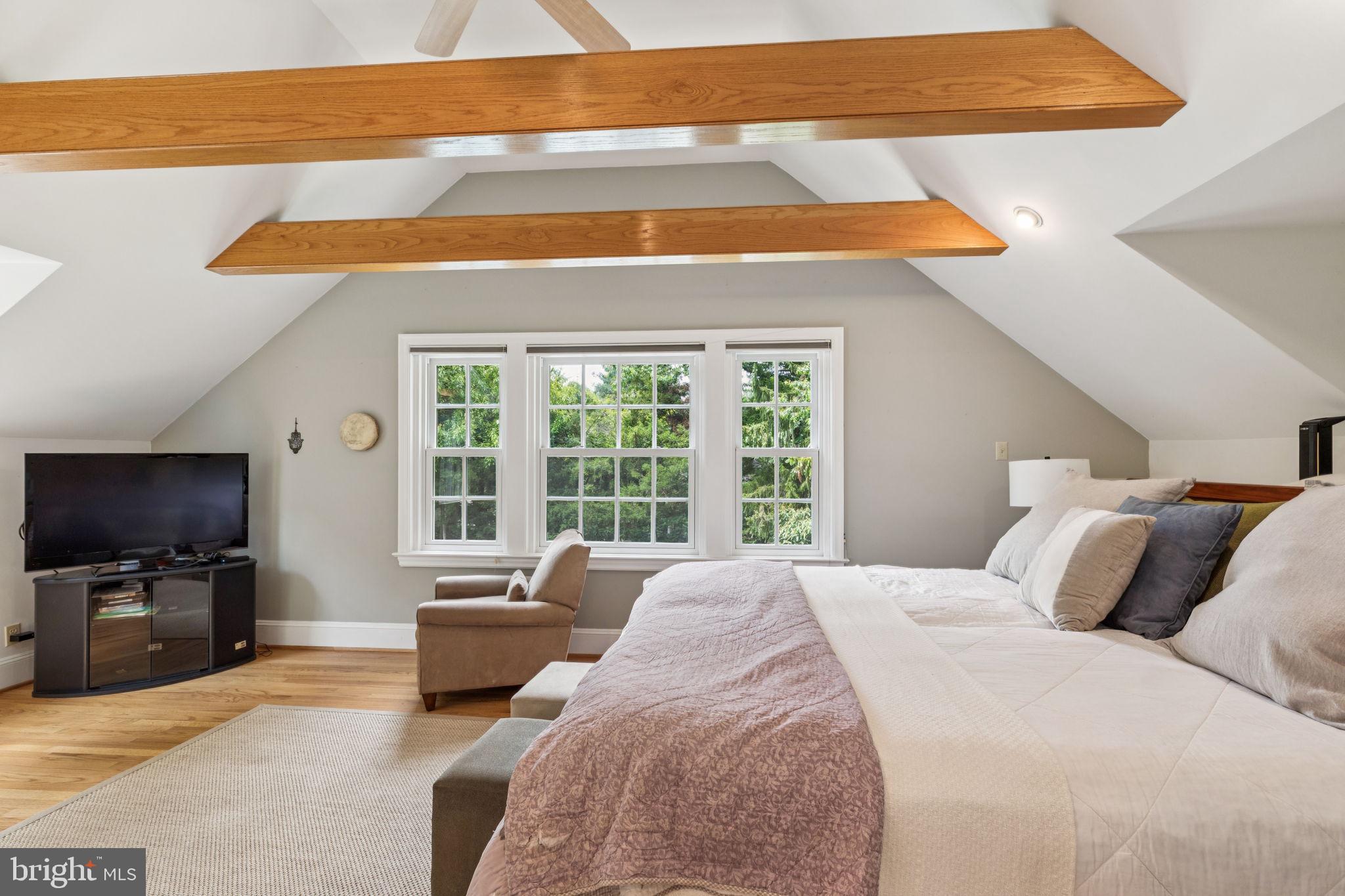 744 Clarendon Road Penn Valley, PA 19072 - Photo 22 of 41 a bedroom with a bed and a flat screen tv