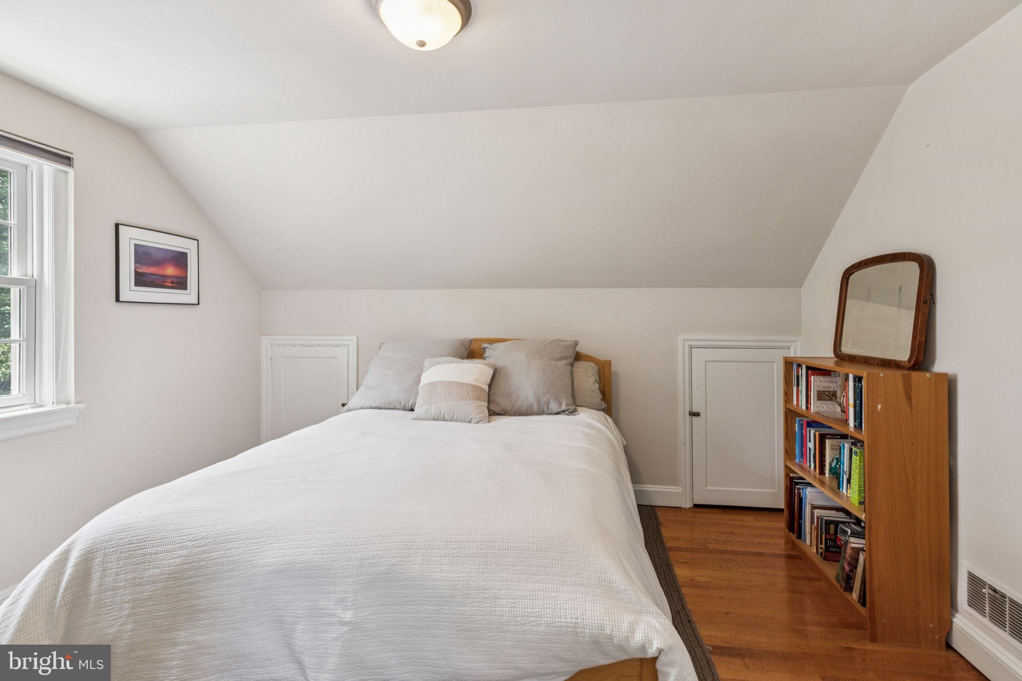 744 Clarendon Road Penn Valley, PA 19072 - Photo 32 of 41 a bedroom with bed and a book shelf