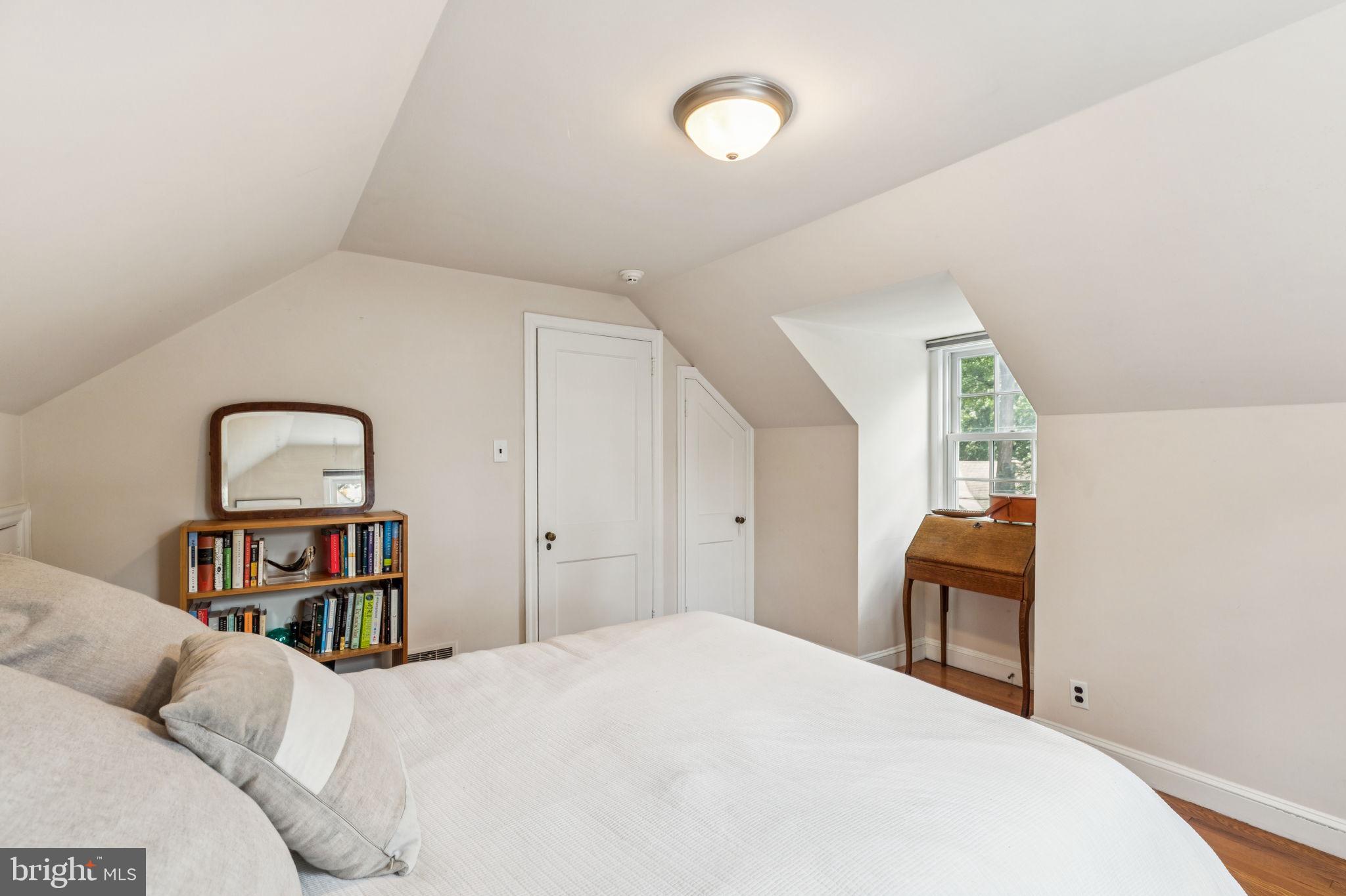 744 Clarendon Road Penn Valley, PA 19072 - Photo 33 of 41 a bedroom with a bed and a book shelf