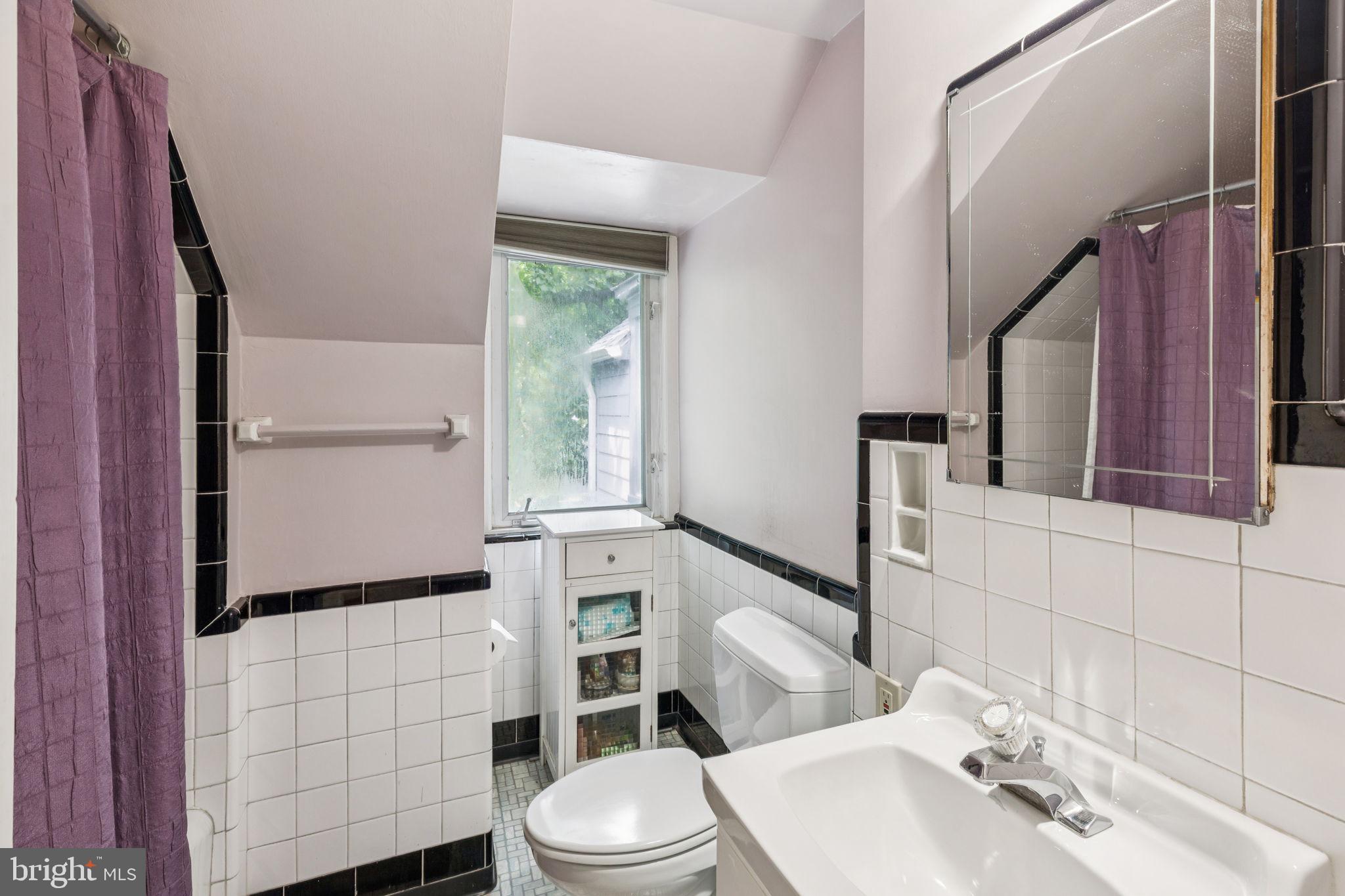 744 Clarendon Road Penn Valley, PA 19072 - Photo 35 of 41 a bathroom with a sink a toilet and shower