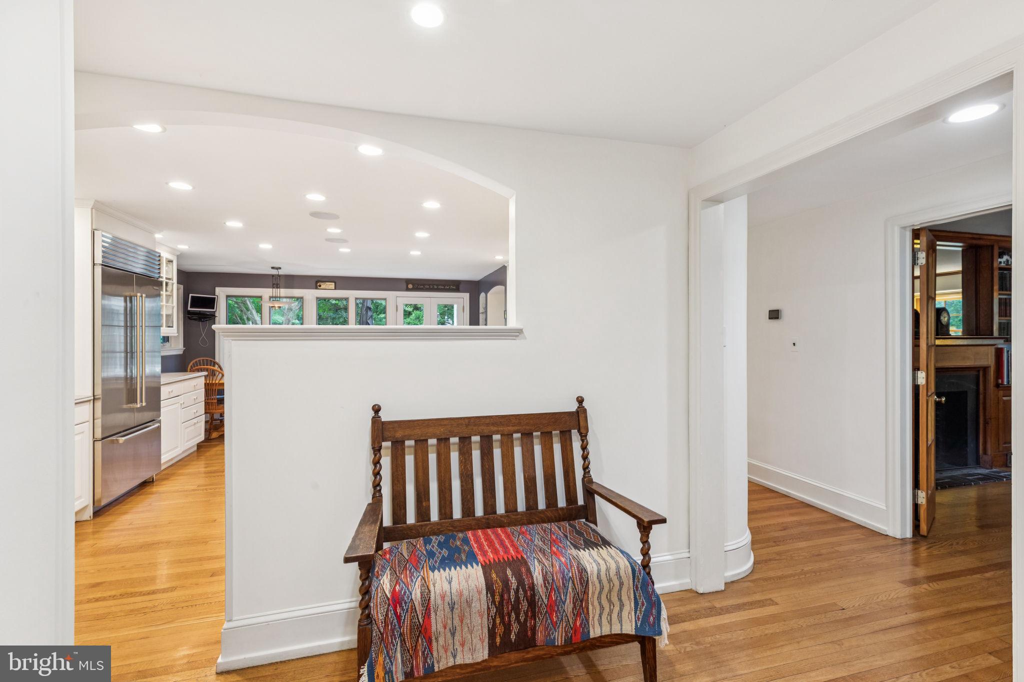 744 Clarendon Road Penn Valley, PA 19072 - Photo 7 of 41 a view of a hallway with wooden floor and dining room