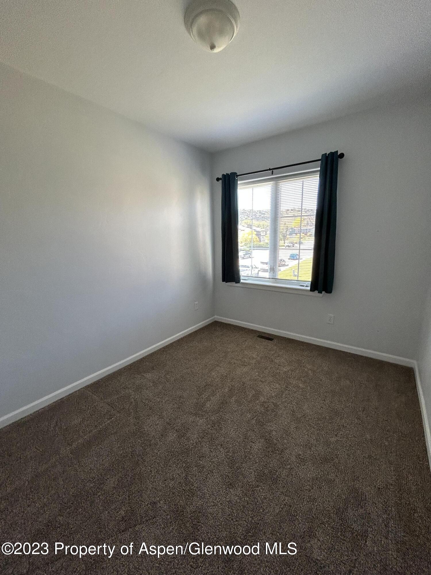 710 West 24th Street Rifle, CO 81650 - Photo 11 of 19 an empty room with a window