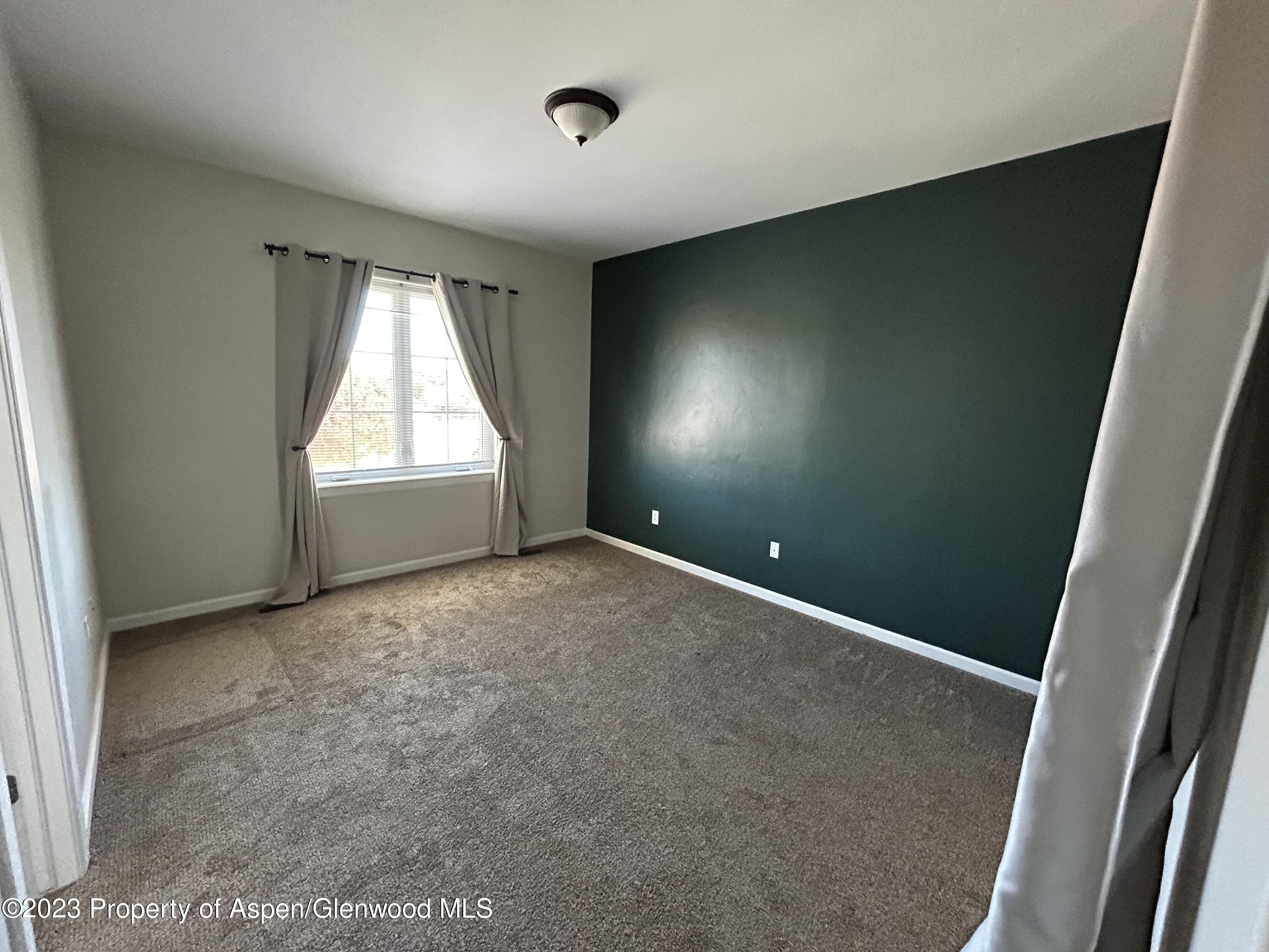 710 West 24th Street Rifle, CO 81650 - Photo 13 of 19 an empty room with windows