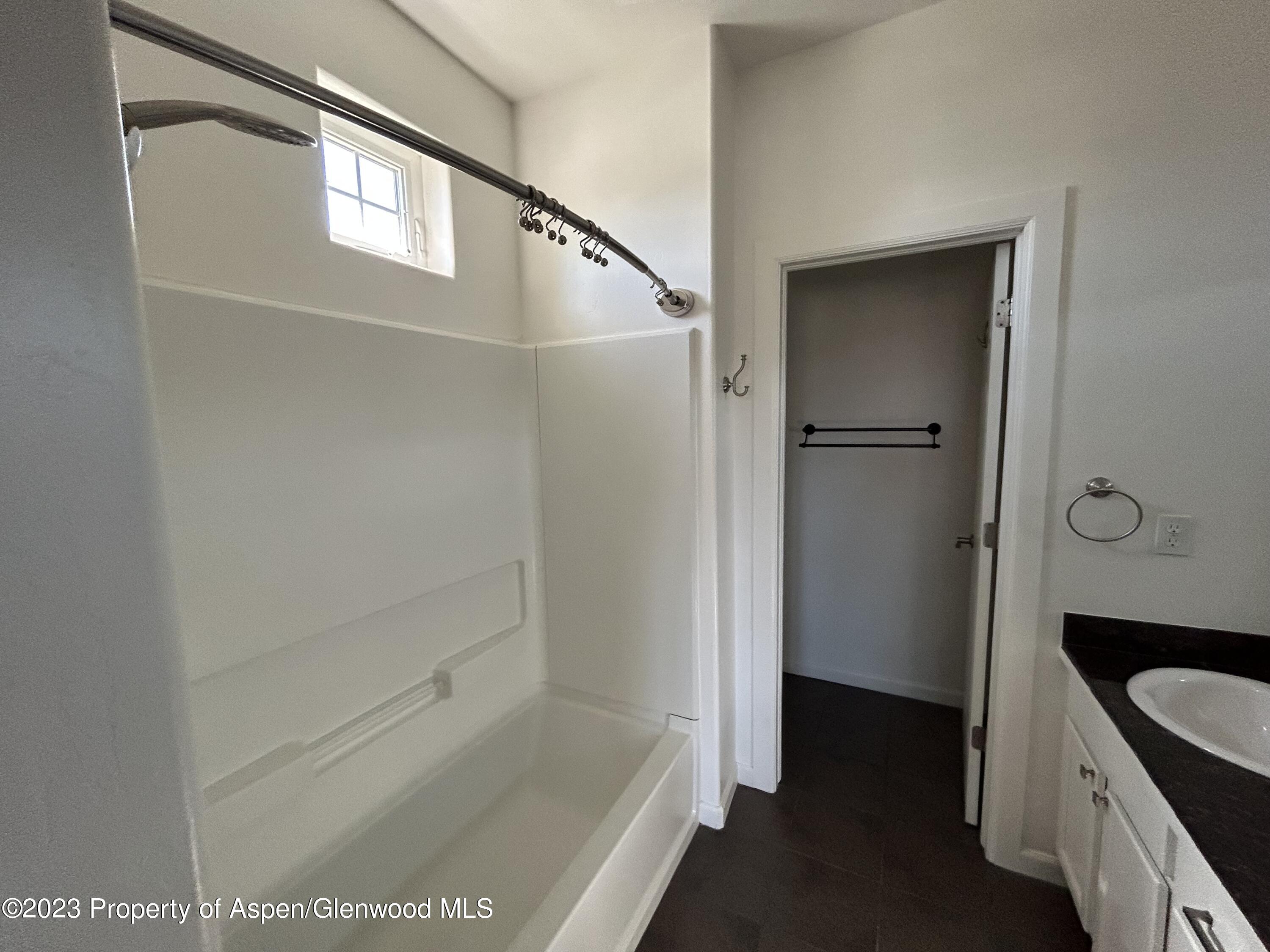 710 West 24th Street Rifle, CO 81650 - Photo 15 of 19 a bathroom with a bathtub and shower