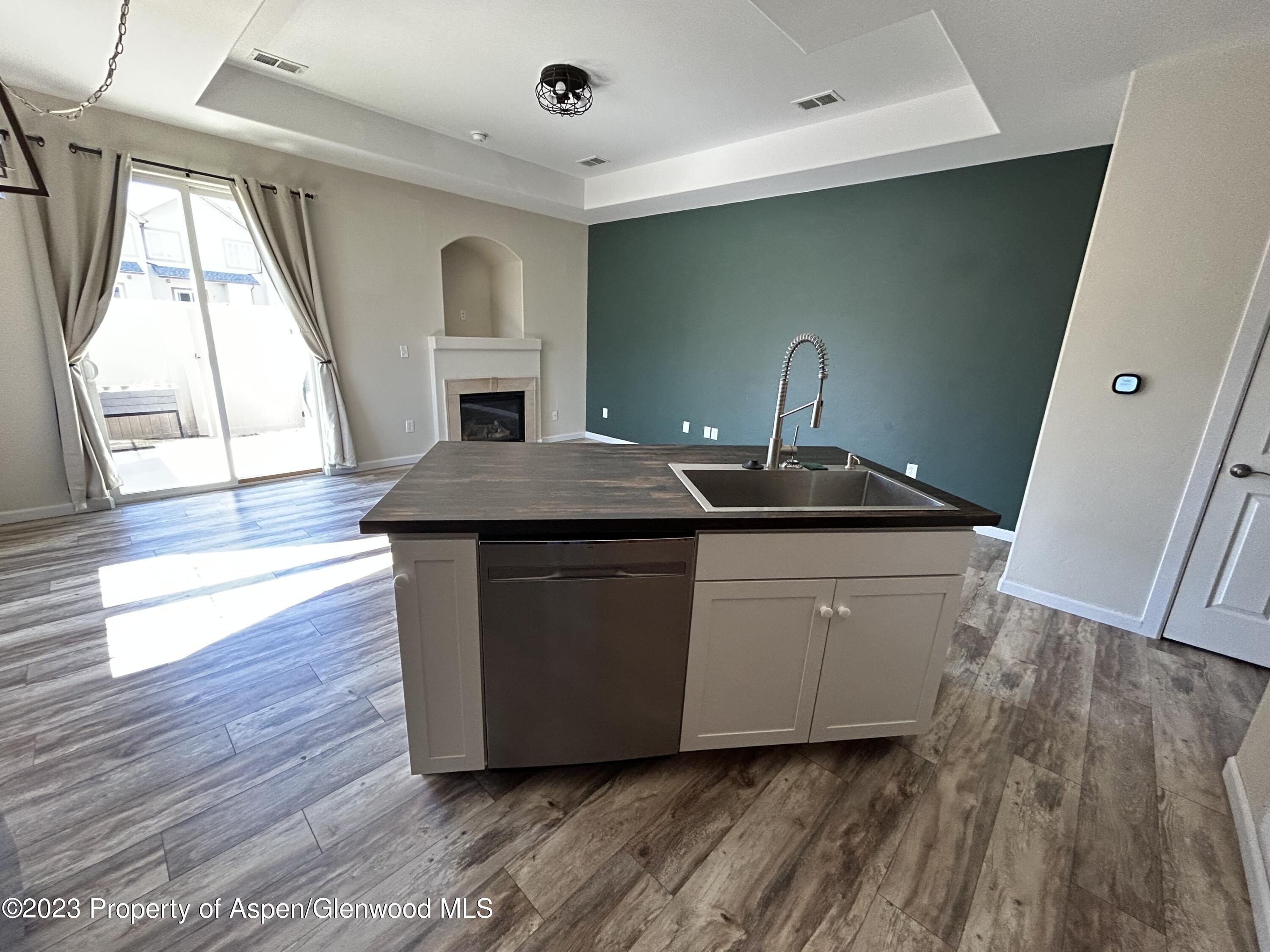 710 West 24th Street Rifle, CO 81650 - Photo 6 of 19 a room with wooden floors and pool table