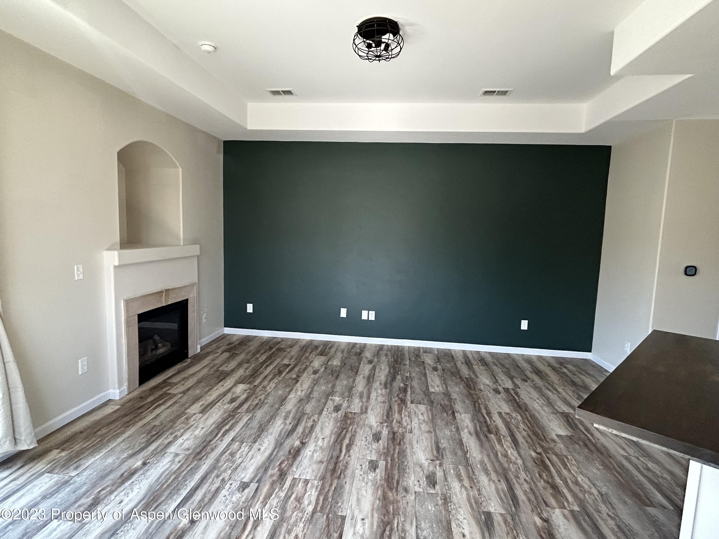 710 West 24th Street Rifle, CO 81650 - Photo 7 of 19 a view of a livingroom with a fireplace