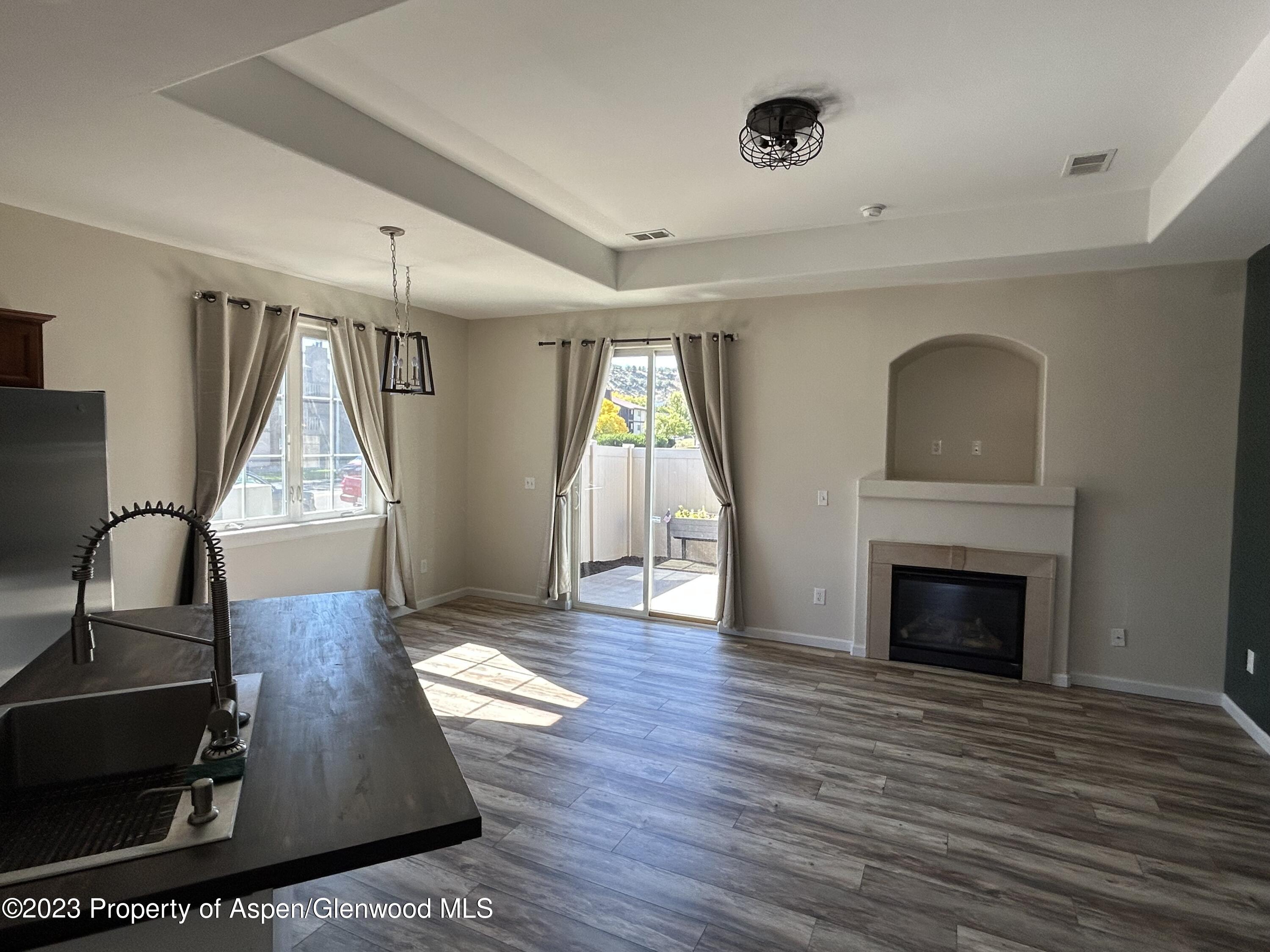 710 West 24th Street Rifle, CO 81650 - Photo 8 of 19 a living room with furniture and a fireplace