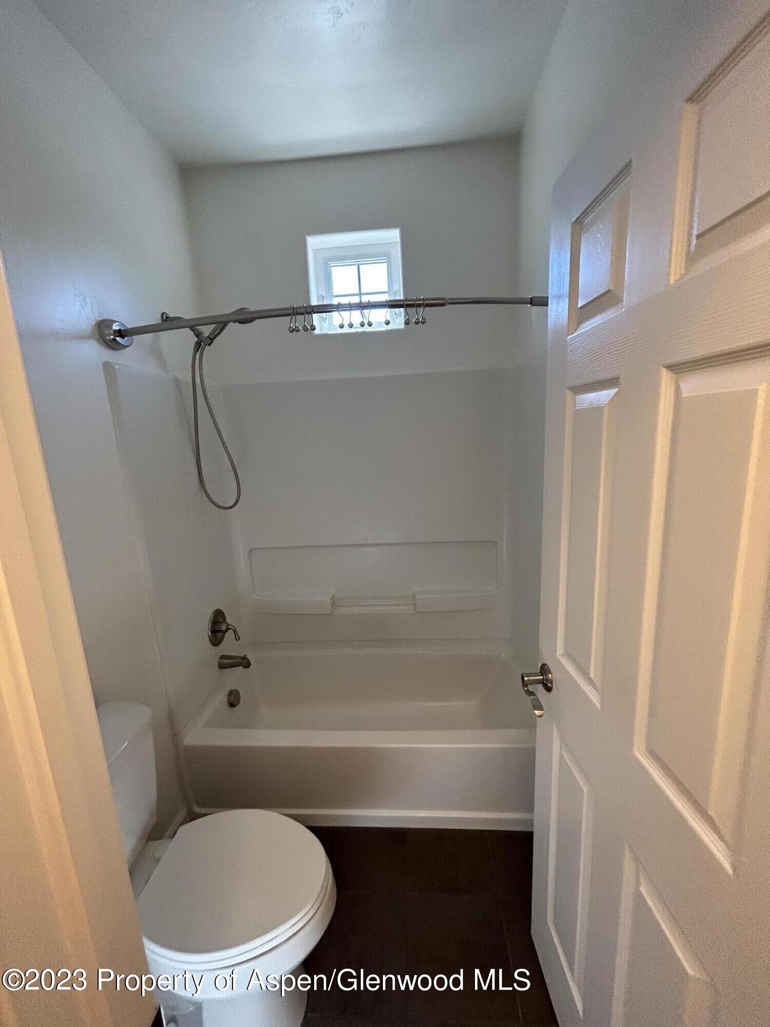 710 West 24th Street Rifle, CO 81650 - Photo 10 of 19 a bathroom with a toilet and a shower