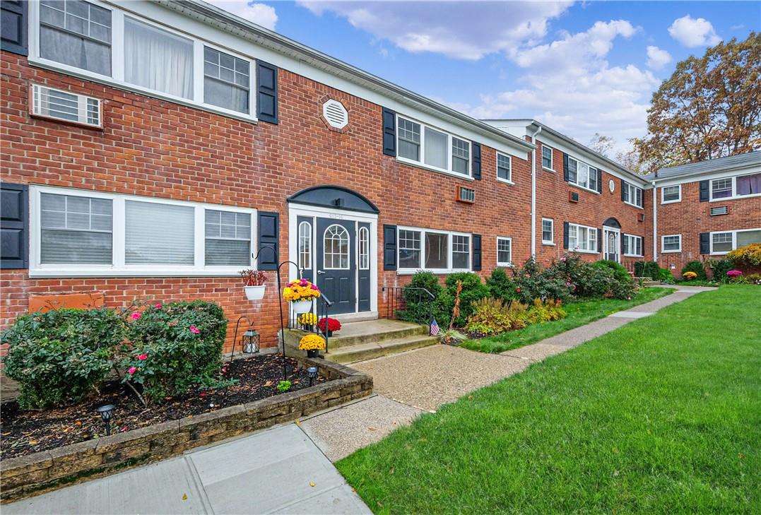 1879 Crompond Road, Unit G13 Peekskill, NY 10566 - Photo 1 of 1 a front view of a house with garden