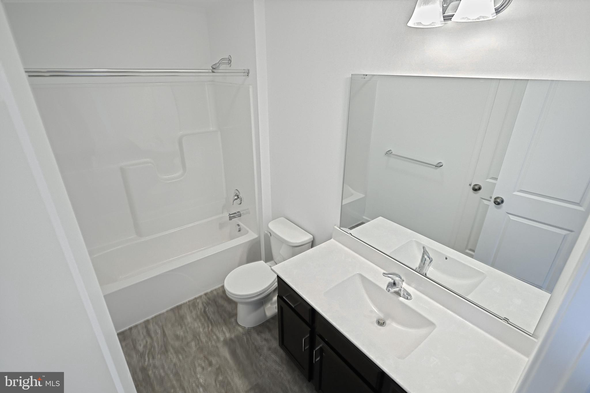 Meriwether Plan At Stone Mill Estates Duncannon, PA 17020 - Photo 17 of 28 a bathroom with a sink a toilet and shower