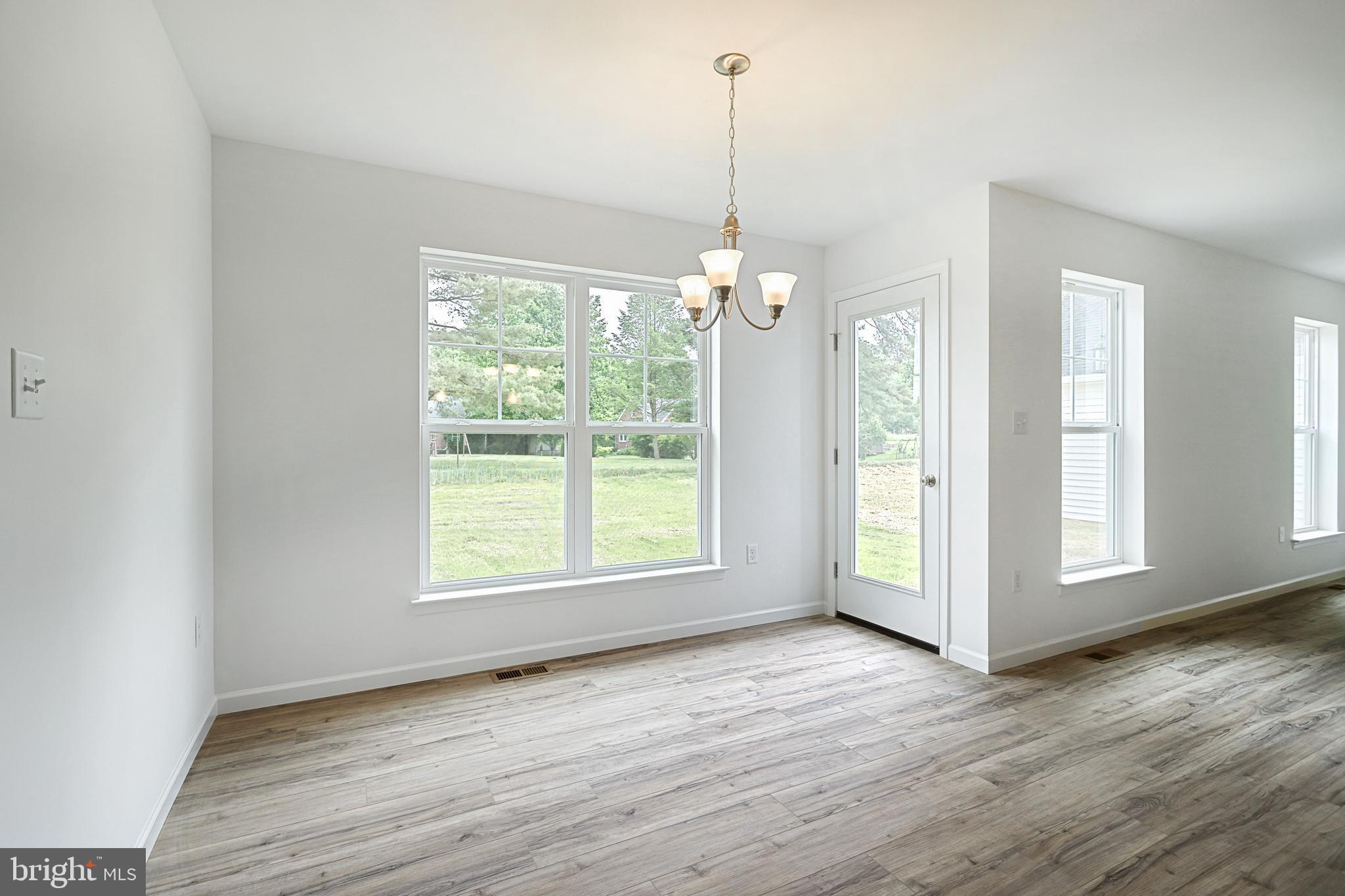 Meriwether Plan At Stone Mill Estates Duncannon, PA 17020 - Photo 10 of 28 a view of an empty room with wooden floor and a window