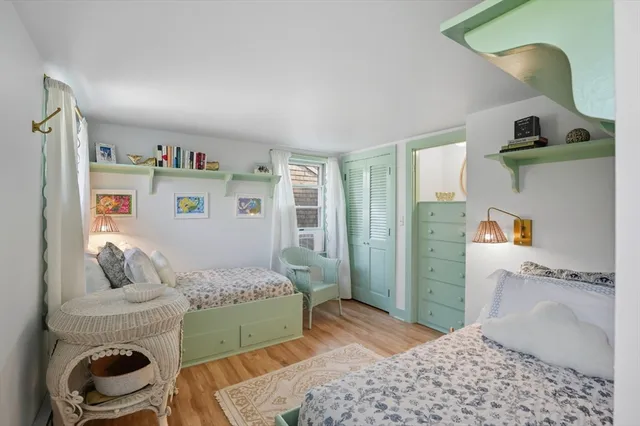 a bedroom with a bed and a cabinets