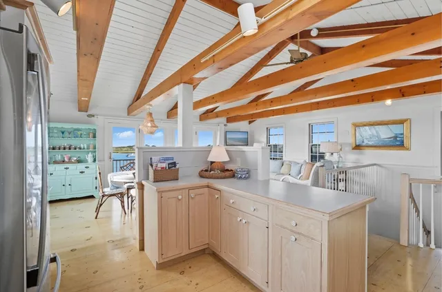 a kitchen with stainless steel appliances granite countertop a sink and cabinets