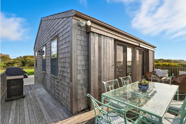 a balcony view with a seating space