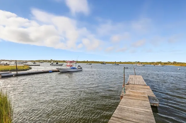 a view of a house with backyard and porch