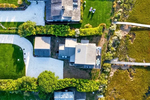 an aerial view of residential houses with outdoor space