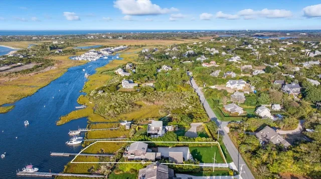 an aerial view of a house with a swimming pool