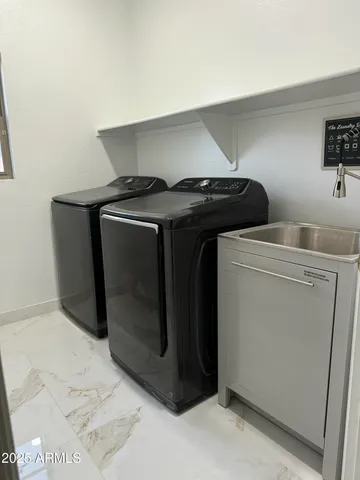 a utility room with dryer and washer