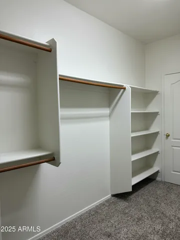 a view of an empty walk in closet