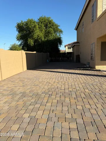 a view of a swimming pool with a yard