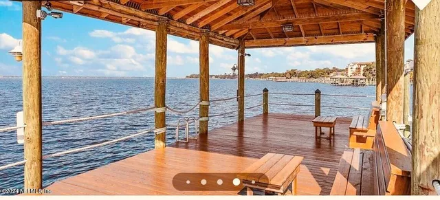 a view of a city from a patio with swimming pool