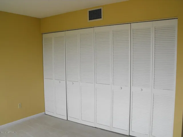 a front view of building with garden