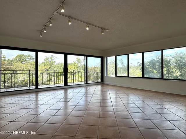 a kitchen with stainless steel appliances granite countertop a sink and a stove