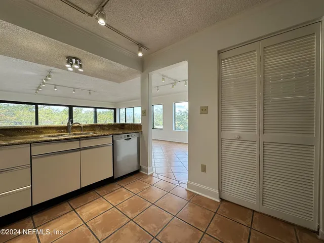 a view of balcony with wooden floor and city view