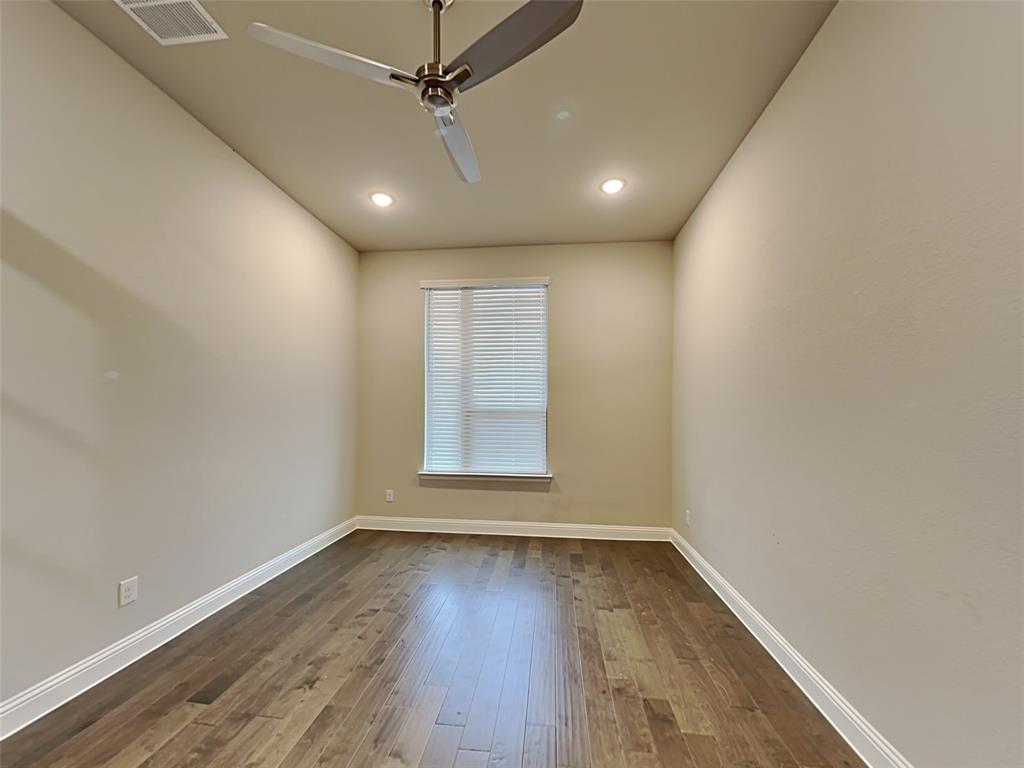 8262 Ottowa Ridge Frisco, TX 75034 - Photo 20 of 24 an empty room with wooden floor and windows