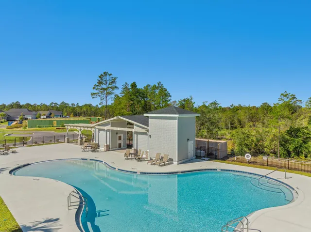 a view of a swimming pool with a patio