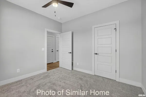 a living room with stainless steel appliances kitchen island granite countertop a couch and a view of living room