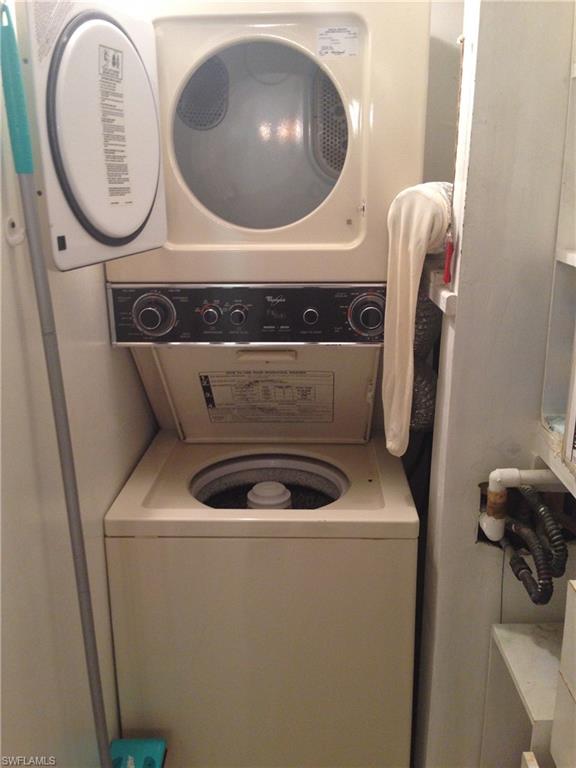 3760 Inverrary Drive, Unit 1W Lauderhill, FL 33319 - Photo 13 of 32 Laundry area with stacked washer / dryer