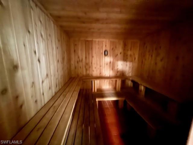 3760 Inverrary Drive, Unit 1W Lauderhill, FL 33319 - Photo 26 of 32 Relaxing sauna featuring wooden ceiling, wood walls, and wood finished floors