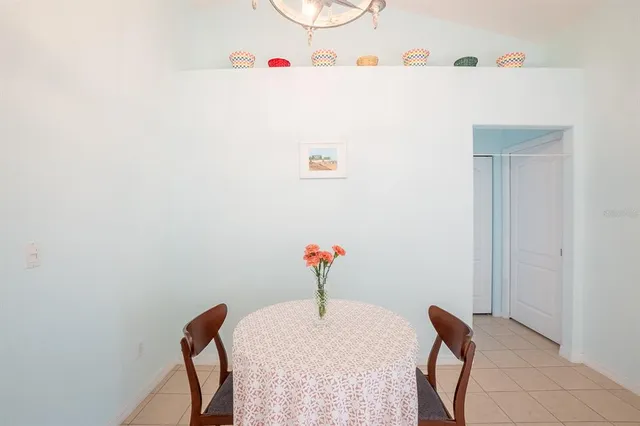 a view of a dining area with furniture and wooden floor