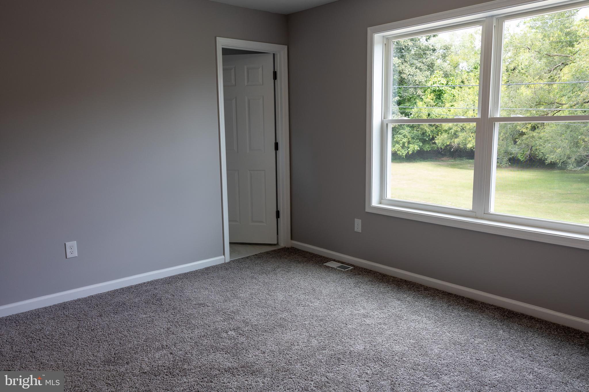 348 Colfax Street Bridgeton, NJ 08302 - Photo 15 of 26 an empty room with a window