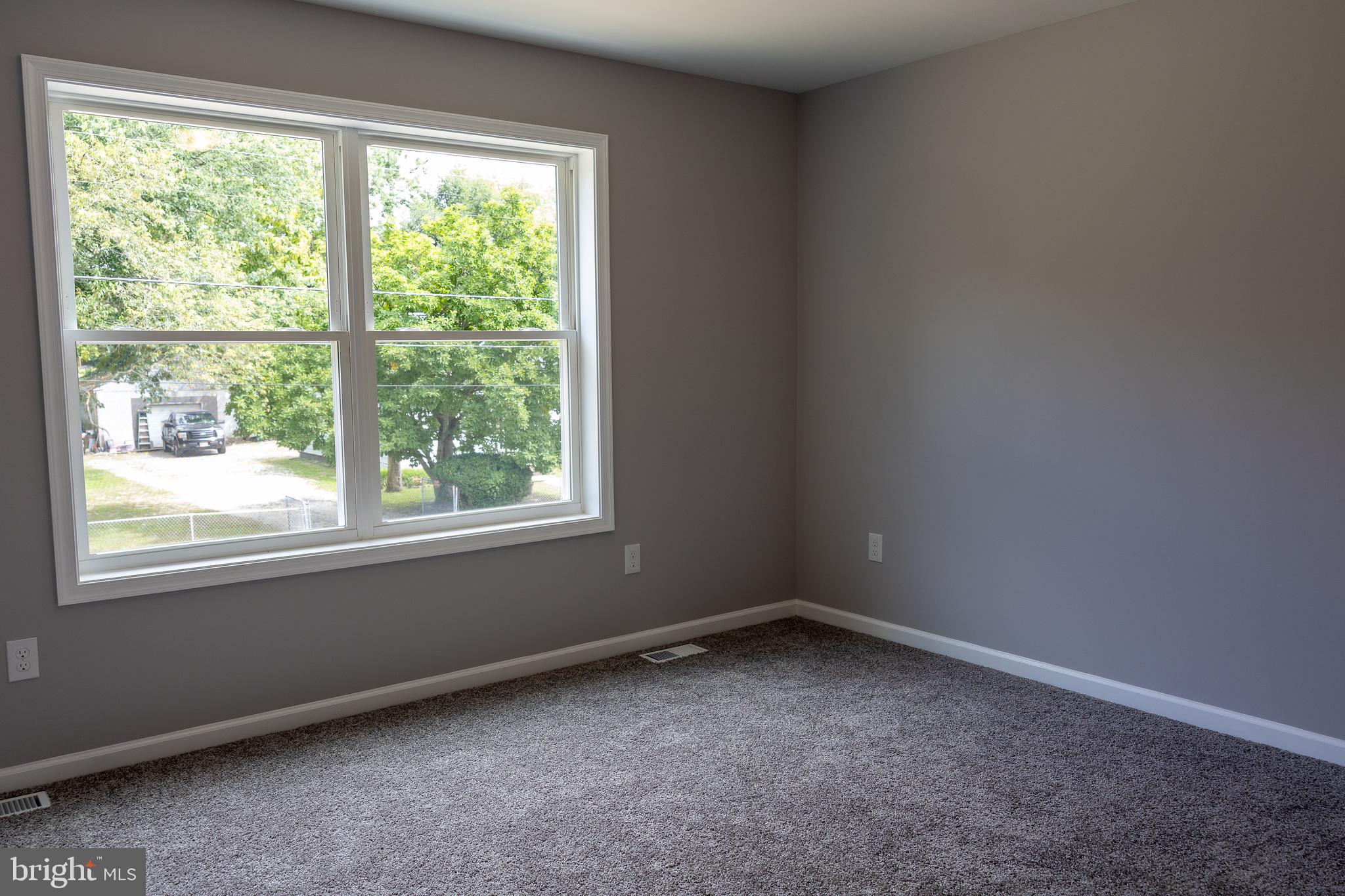 348 Colfax Street Bridgeton, NJ 08302 - Photo 16 of 26 an empty room with a window
