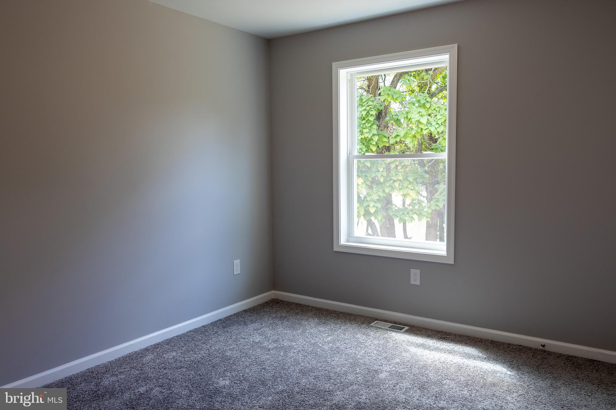 348 Colfax Street Bridgeton, NJ 08302 - Photo 18 of 26 an empty room with a window