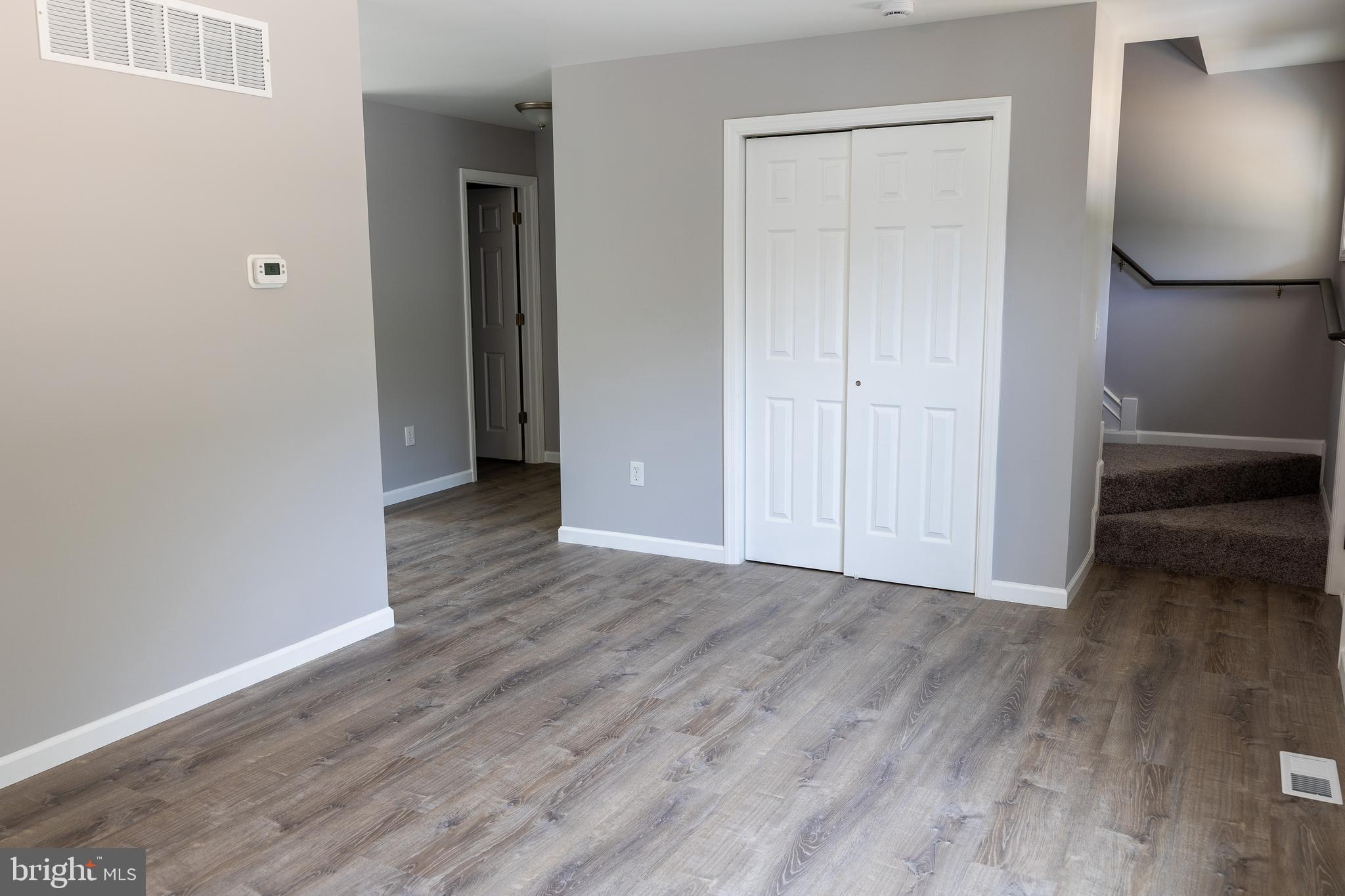 348 Colfax Street Bridgeton, NJ 08302 - Photo 9 of 26 an empty room with wooden floor and closet